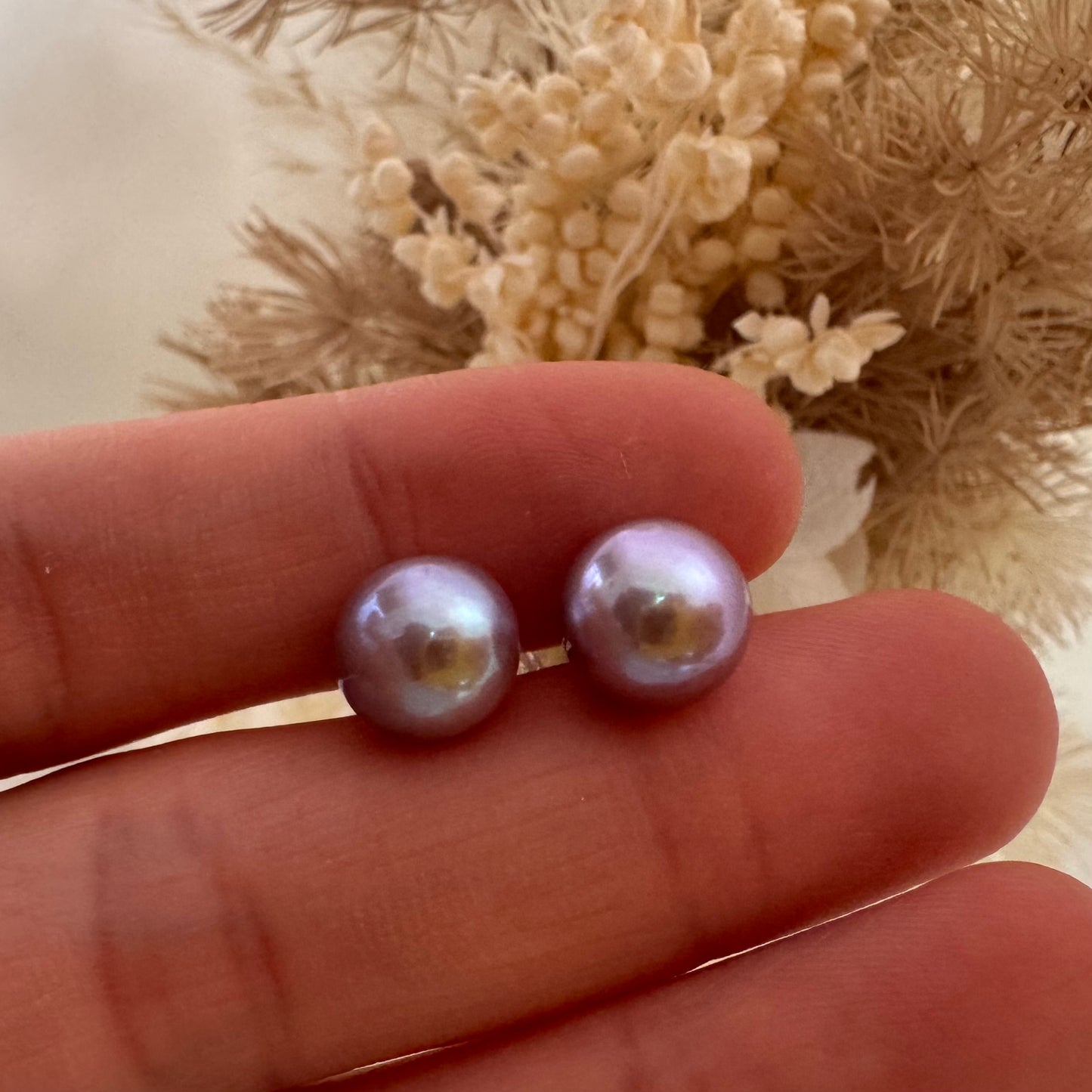 Large purple pearl stud earrings