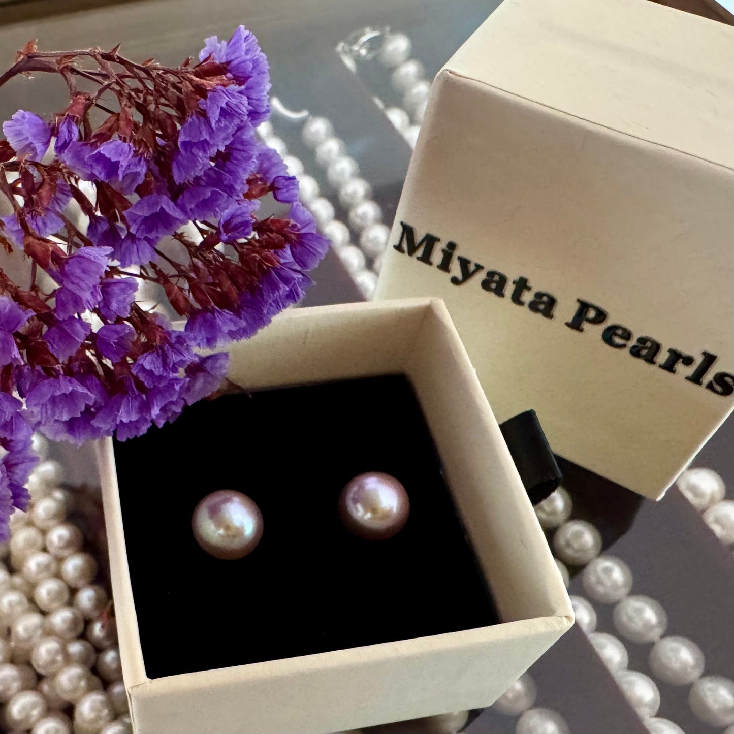Large purple pearl stud earrings
