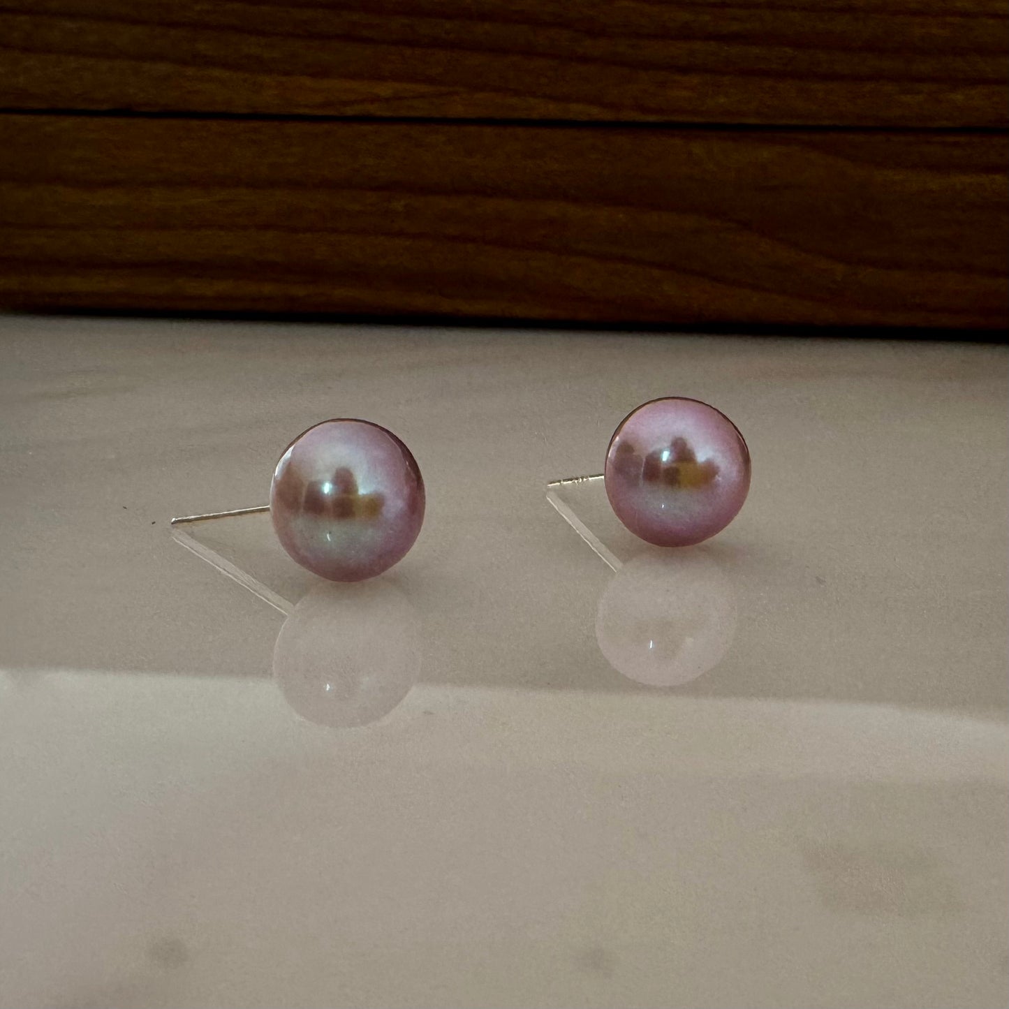 Large purple pearl stud earrings