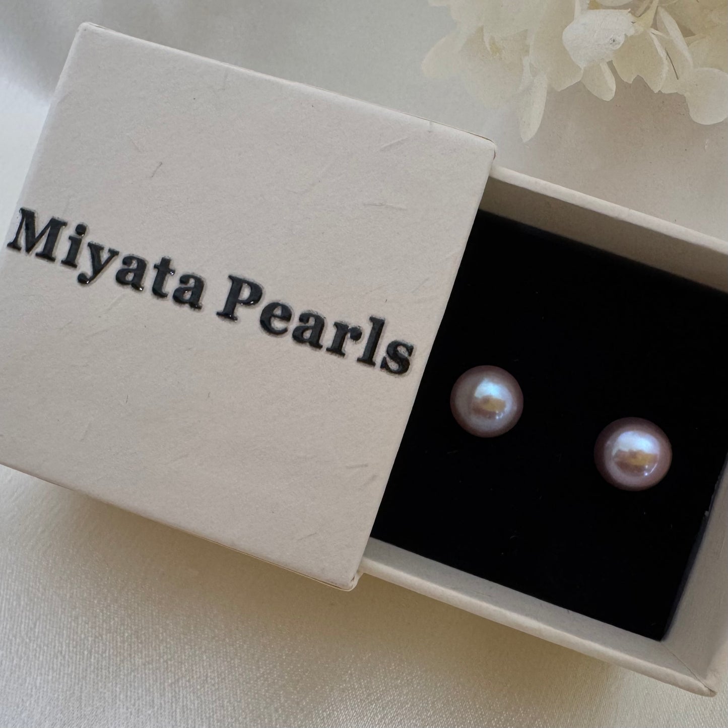 Large purple pearl stud earrings