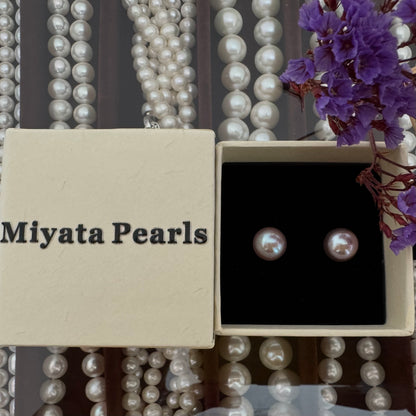 Large purple pearl stud earrings
