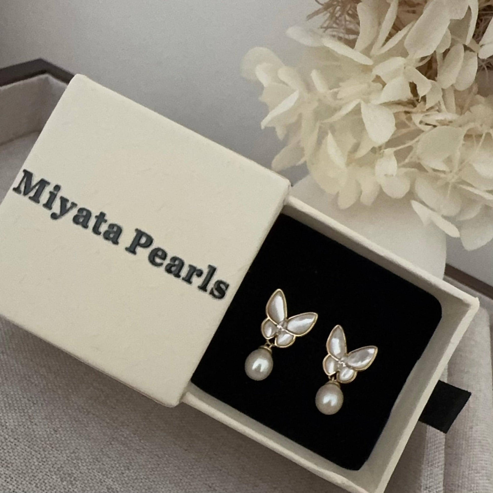 Butterfly Grace Pearl drop earrings